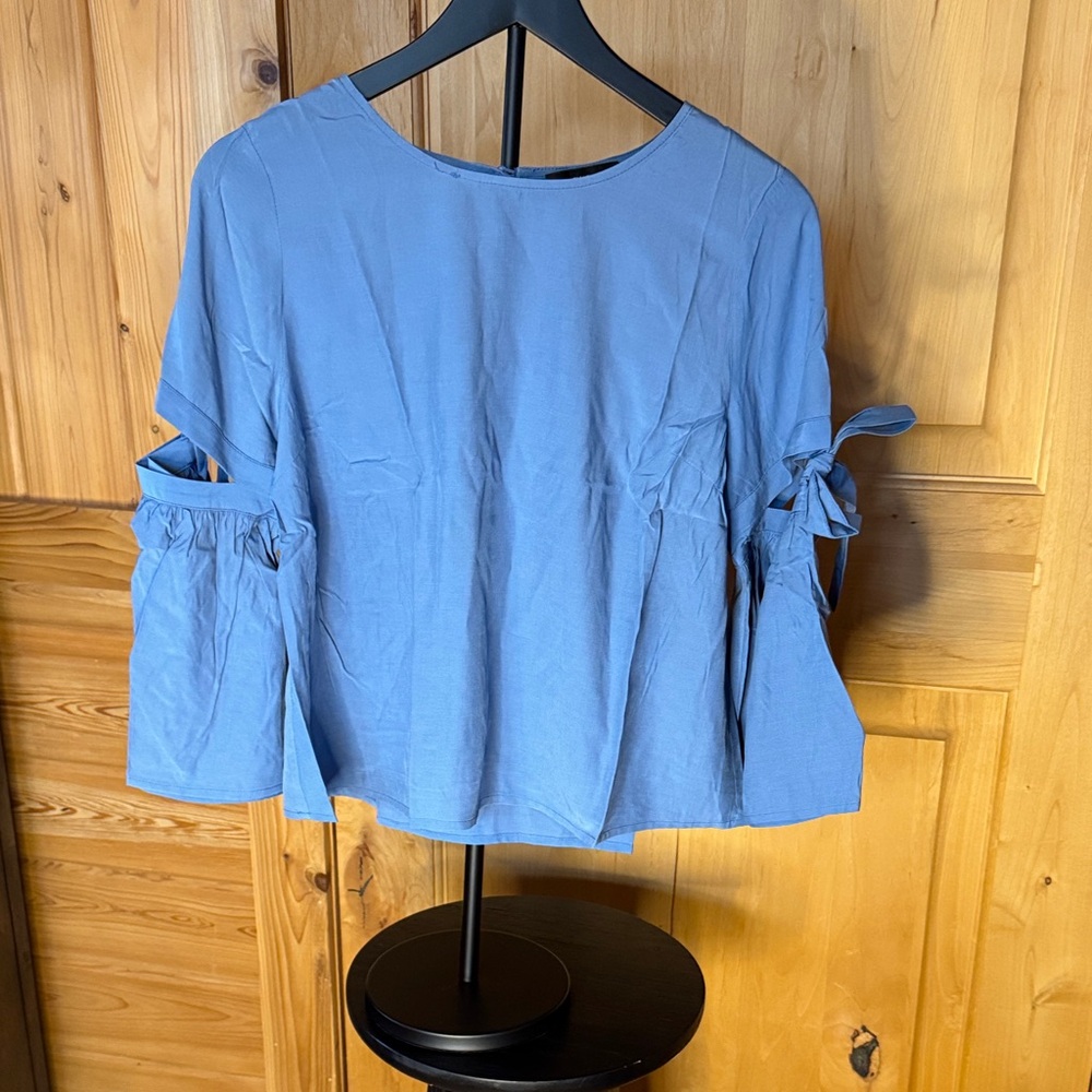 Elegant Sky Blue Blouse with Bow Sleeves